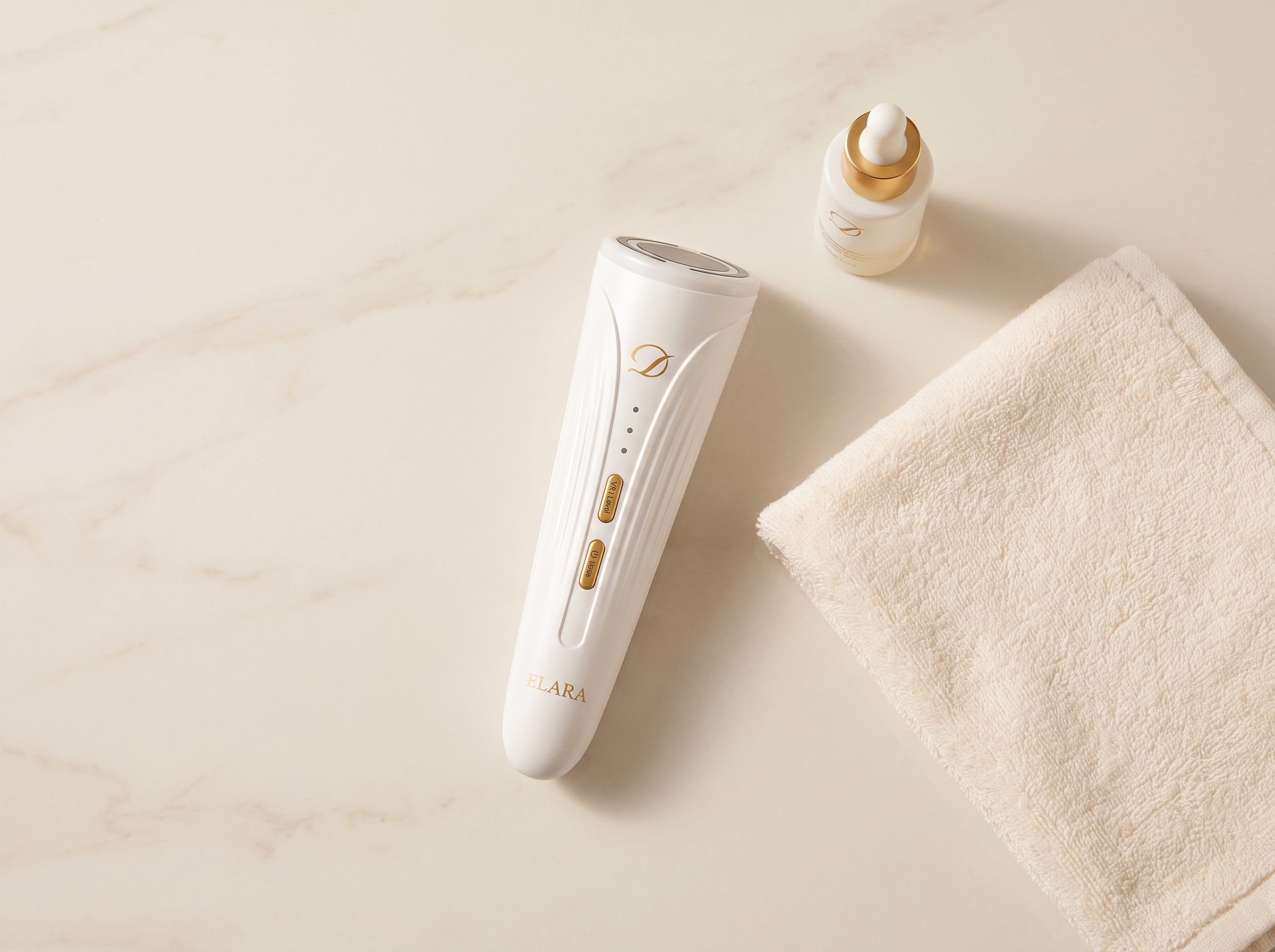 Image of ELARA device resting on cream marble beside a folded towel and a serum bottle